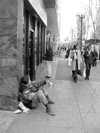 Full length of woman standing in city