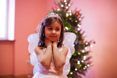 Portrait of girl with christmas tree