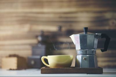 Close-up of coffee cup on table