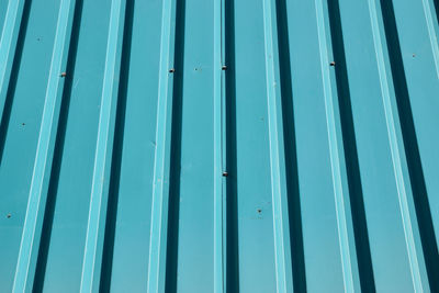 Low angle view of blue window on building