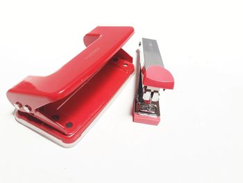 High angle view of red laptop on white background