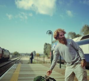 Close-up of woman standing against sky