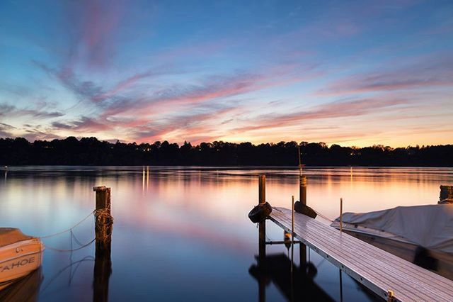 sunset, water, tranquil scene, tranquility, sky, scenics, lake, beauty in nature, reflection, nature, idyllic, orange color, cloud - sky, cloud, pier, tree, calm, silhouette, outdoors, no people