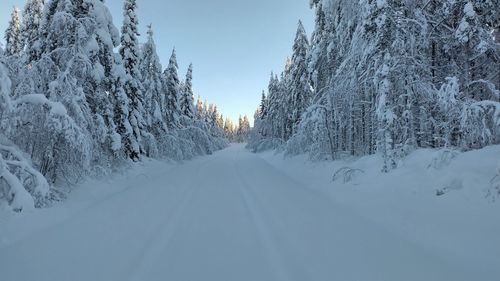 Panoramic view of snow covered mountain against sky