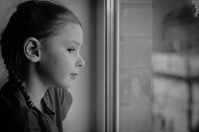 Close-up portrait of girl looking away