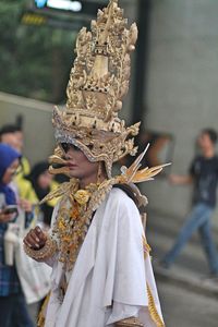 Side view of mid adult woman in traditional clothing standing outdoors