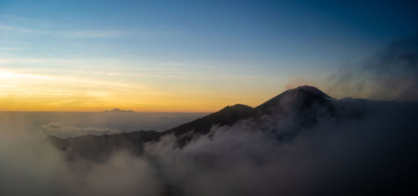 Scenic view of mountains against sky during sunset