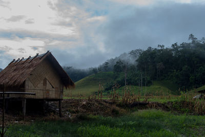 House on field against sky