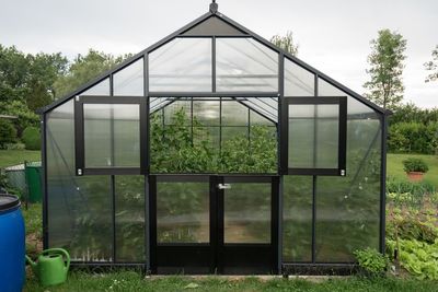 Built structure on field against sky