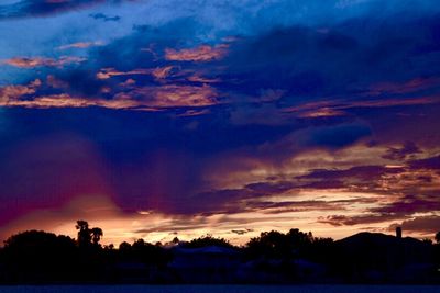 Scenic view of dramatic sky at sunset