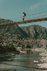 Bridge over river against sky