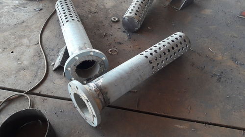 Steel pipe drill holes piping works, industrial concept.