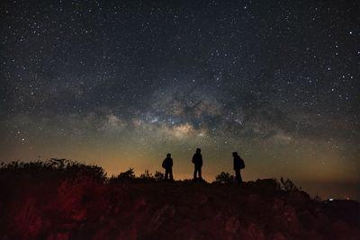 Silhouette of people at night