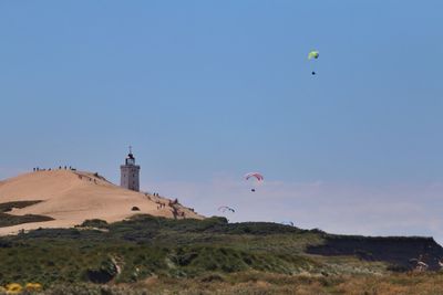 Lighthouse against clear blue sky