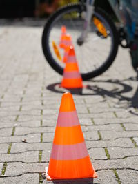 Traffic cones in row on footpath