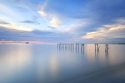 Scenic view of lake against sky during sunset