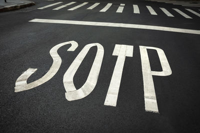 High angle view of arrow sign on road