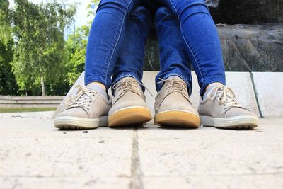 Low section of man sitting outdoors