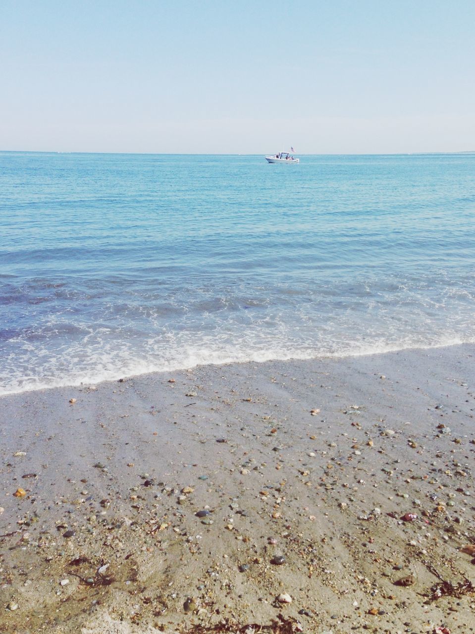 sea, horizon over water, water, transportation, beach, nautical vessel, clear sky, mode of transport, scenics, tranquil scene, tranquility, beauty in nature, shore, boat, nature, copy space, blue, seascape, sky, sand