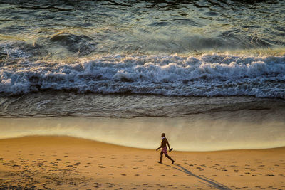 Full length of woman on beach