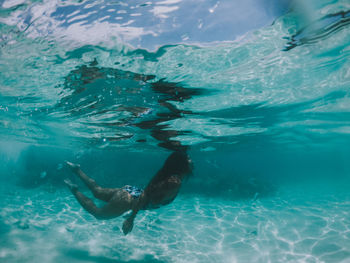 Woman swimming in undersea