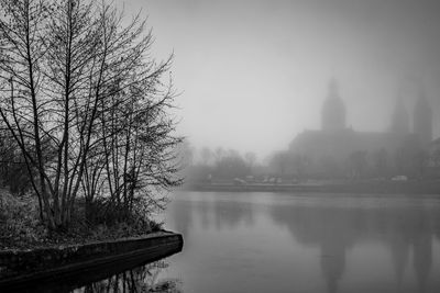 Scenic view of lake during foggy weather