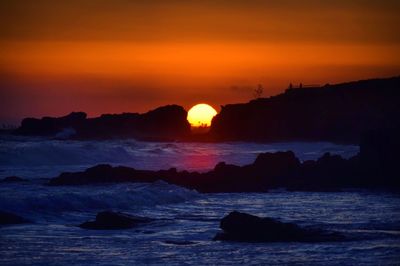 Scenic view of sea at sunset