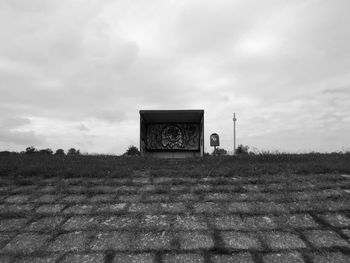 Old ruin on field against sky