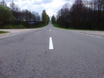 Empty road along countryside landscape