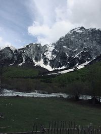 Scenic view of snowcapped mountains against sky