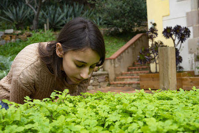 Portrait of woman with plants