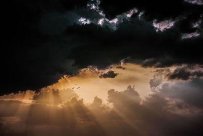 Sunbeams shinging through dramatic sky