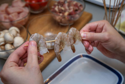 Midsection of person preparing food