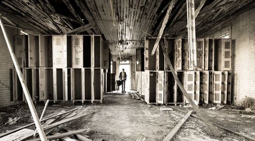 Man in corridor of building