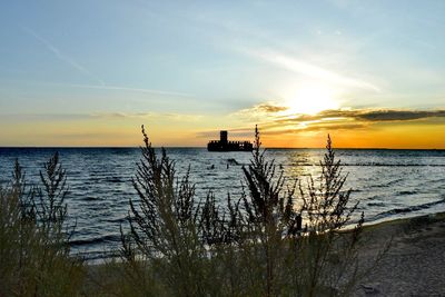 Scenic view of sea against sky during sunset