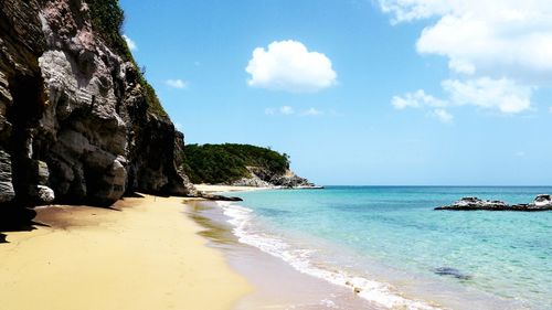 Scenic view of beach against sky
