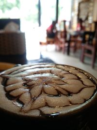 Close-up of chocolate cake in plate on table