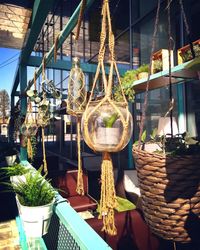 Illuminated lanterns hanging at market stall