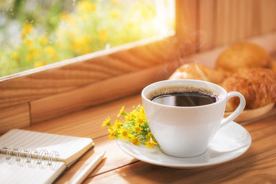 Close-up of coffee cup on table