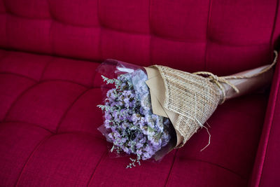 High angle view of flower bouquet on sofa