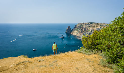 Man traveler enjoying landscape of cape fiolent locate in crimea. sea view. 