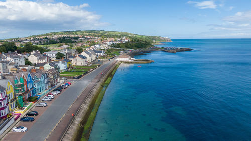 High angle view of sea and buildings against sky