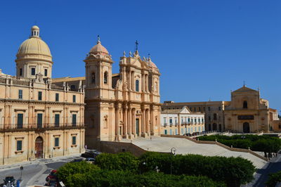 Low angle view of buildings against blue sky