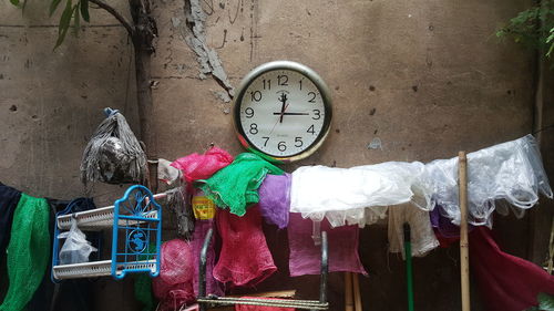 Low angle view of clock hanging on wall