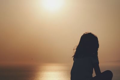 Silhouette of child on beach