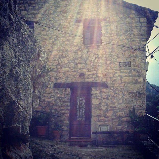 architecture, built structure, building exterior, old, wall - building feature, low angle view, building, brick wall, abandoned, sunlight, no people, history, weathered, stone wall, day, damaged, wall, window, outdoors, house