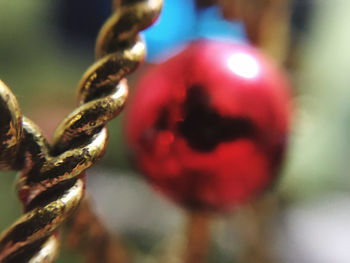 Close-up of rusty chain against blurred background