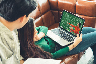 High angle view of woman using mobile phone