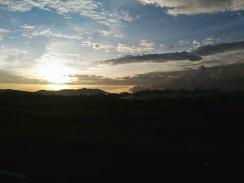 Scenic view of landscape at sunset