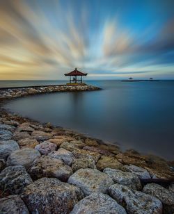 Scenic view of sea against sky at sunset